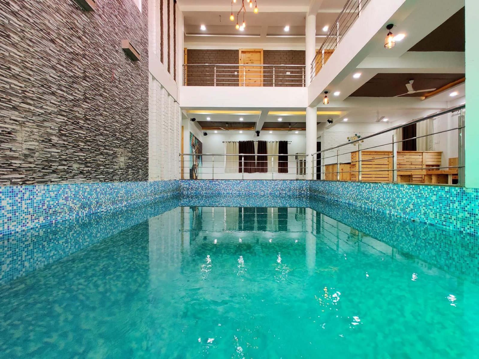 Mosaic-tiled private pool at Mangli Lake Farm