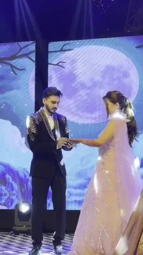 Engagement ring ceremony on the stage at Mangli Lake Farm
